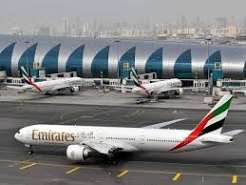 Fly Emirates aircraft at a Dubai airport terminal